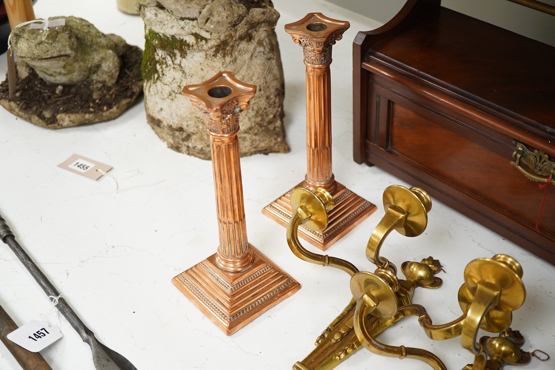 A pair of Corinthian column copper candlesticks, a pair of three branch sconces and pair of brass candlesticks, together with brass-mounted mahogany wall shelf /cabinet - 33cm high